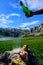 Pouring of natural Asturian cider made fromÂ fermented apples from green bottle and high height with view on Covadonga lake and